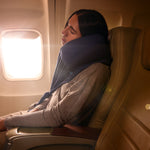 Cozy travel neck pillow in navy, providing comfort for flights; features soft fabric and supportive design.