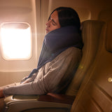 Cozy travel neck pillow in navy, providing comfort for flights; features soft fabric and supportive design.
