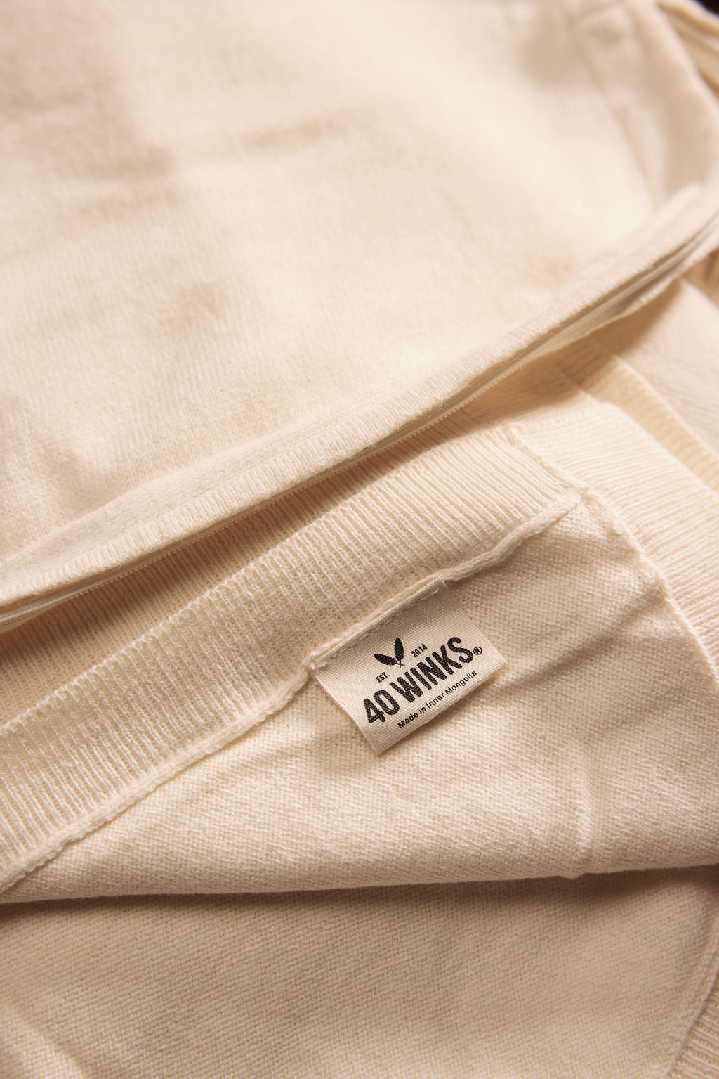 Cream-colored cotton sweater by 40 Winks, featuring a soft texture and cozy design, perfect for casual wear.